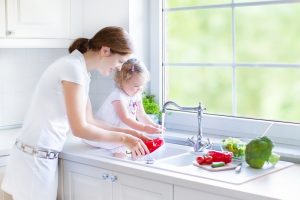 mother-and-daughter-by-kitchen-sink