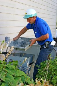 technician-working-with-outdoor-ac-unit