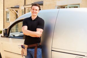 service-professional-standing-in-front-of-van