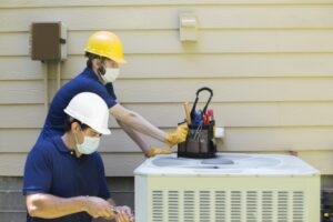 technicians-working-on-air-conditioner