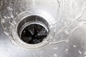 water-swirling-down-a-kitchen-sink-garbage-disposal