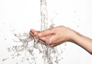 water-splashing-into-a-person's-hand