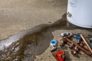 leaking-water-heater-with-tools-for-repair